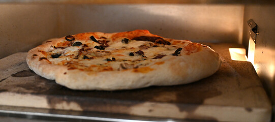 pizza cooking in the oven, fast food, 