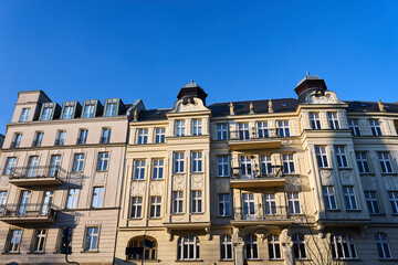 Fototapeta na wymiar facades of historic tenement houses with balconies in the city of Poznan
