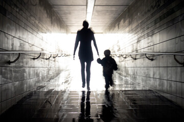 Mom and boy in tunnel