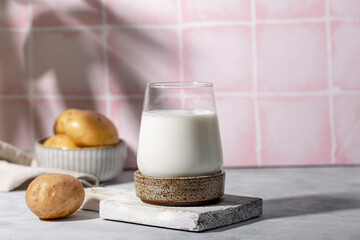 A glass of potato milk on the table. Plant-Based Potato Milk Alternative, Vegan Milk