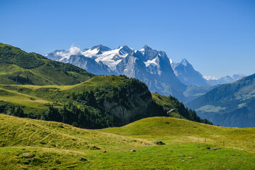 Fototapeta na wymiar Majestic Wetterhorn peak covered by eternal ice in canton of Bern