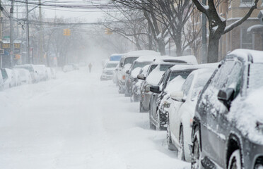 City bad weather, snow storm in city streets, cars covered by snow, heavy snow fall. - obrazy, fototapety, plakaty