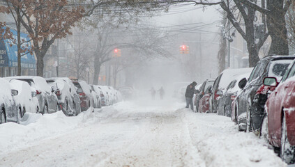 City bad weather, snow storm in city streets, cars covered by snow, heavy snow fall.