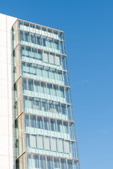 Fototapeta premium Glass windows of facade modern building in Lisbon city, Portugal