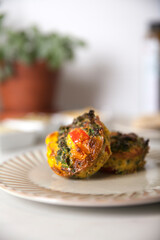 Two egg frittata muffin on a plate