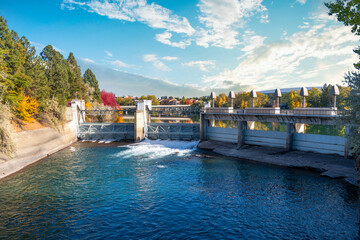 The Upper Falls Reservoir and Dam at Riverfront Park in downtown Spokane, Washington, USA with...