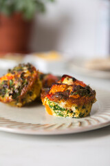 Two egg frittata muffin on a plate