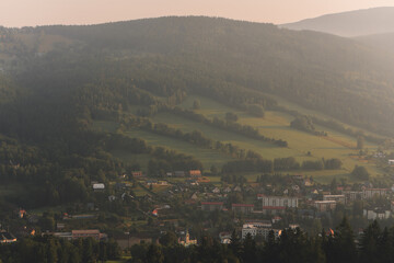 Beautiful sunrise in Krkonose, captured from lookout called Straz above city Rokytnice nad Jizerou, Czech Republic