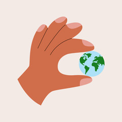 Hand holding planet in fingers