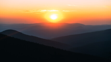 Majestic sunset captured on the top of Krkonose mountains, meadows, peace, sun, warm, good time. Dramatic sunset