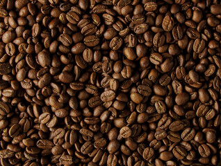 Obraz premium Roasted coffee beans background. Cuban coffee of the highest quality. Arabica