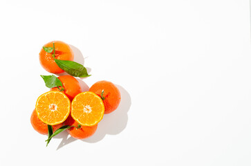 Mandarines, tangerine, clementine with leaves on white background. Top view

