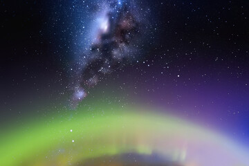 Night starry sky. Milky Way and polar lights. Green aurora borealis