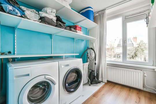 Interior Of Small Clean Laundry Room In Modern Hause