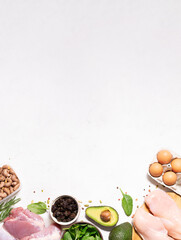 Fresh organic food for low carb keto diet on white marble background long banner format, copy space for your design. Healthy lifestyle and weight loss concept.