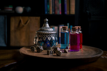 Magical potions and a glass pot with RPG dice