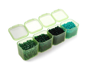 Plastic organizer with different beads on white background