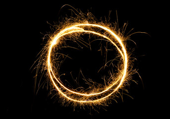 Sparkling round frame isolated on black background