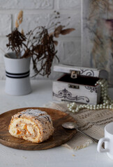 Buttercream cake on a wooden plate in daylight