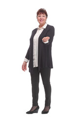 Photo of happy mature woman holding new key and pointing it at camera