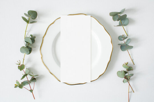 Mockup menu card with eucalyptus leaves on the white background