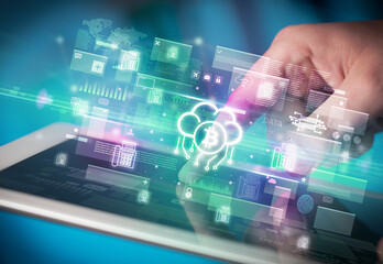 Obraz premium Close-up of a hand using tablet, currency concept