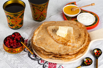 Shrovetide Maslenitsa festival. Russian pancakes blini. Pancakes with honey and jam. Russian spoons. National russian festival. Russian crepes.