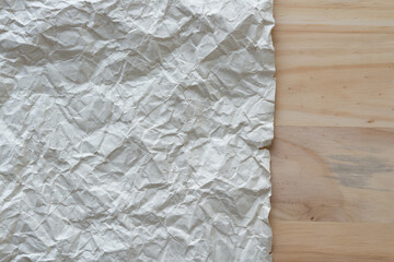 crumpled paper and wood