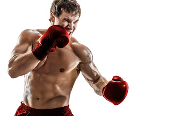 Half length of emotional male boxer who practicing left hook in red gloves on white background. 