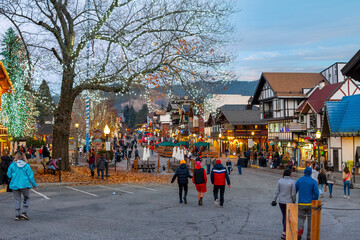 Visitors enjoy the colorful Bavarian themed village of Leavenworth, Washington, USA on a winter...