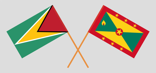 Crossed flags of Guyana and Grenada. Official colors. Correct proportion