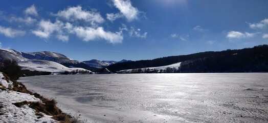Lake frozen landscape in winter in Auvergne