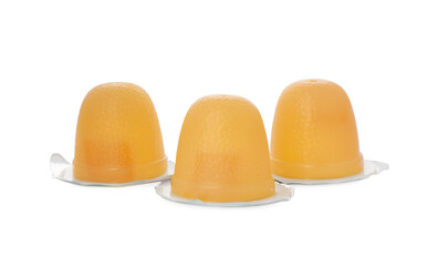 Fototapeta premium Delicious yellow jelly cups on white background
