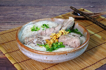 Mee Suo or Long Life Noodles (Chang Shou Mian) with pork ribs soup is a one of famous Phuket food,...