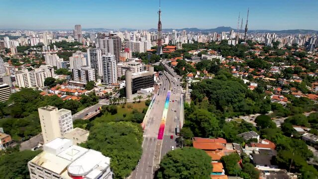 Panning wide of colorful Sumare bridge at downtown Sao Paulo Brazil. Stunning landscape of landmark avenue of city. Urban aerials.