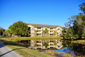 Tampa, Florida, USA, 12 10 2024: The winter foliage landscape of a beautiful apartment community at Tampa Palms, north of Tampa in Florida	
