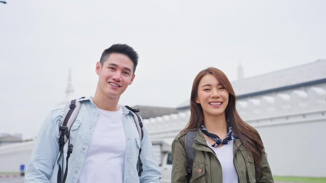 Asian young couple remove mask while travel in city for honeymoon trip. 