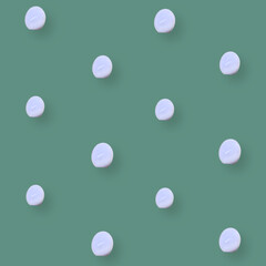 Colorful pattern of chicken eggs on green background. Top view. Flat lay. Pop art design