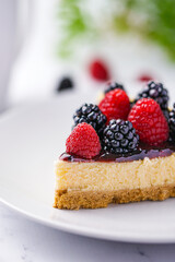 Cheesecakes with fresh berries, raspberry and blackberry.