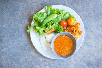 Islamic salad vegetable, tofu and boiled egg topping crispy fried taro dressing sweet bean sauce.