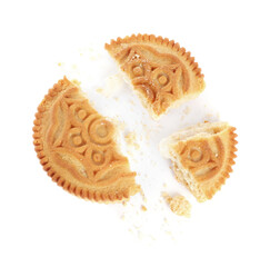 Broken tasty sandwich cookie with cream on white background, top view