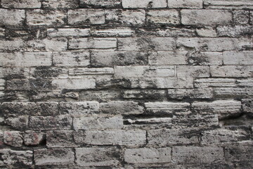 The texture of the stone wall. Old castle stone wall texture background. Stone wall as background or texture. Fragment of stone wall for background or texture