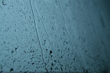 Raindrops on the glass, focus selected