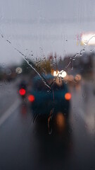 Raindrops on the windshield of the car. Focus selected