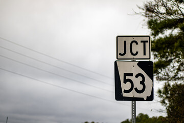 A full-color JCT 53 road sign 