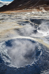 The boiling mud pots and smoking fumaroles of Namafjall Hverir Geothermal Area near Lake Myvatn, northern Iceland