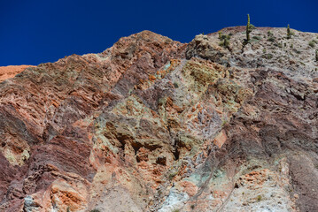 The multi-coloured hills around the town of Purmamarca, Quebrada de Humahuaca, Jujuy Province,...