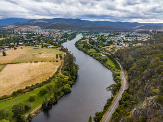High angle aerial drone view of River Derwent, one of the major rivers on the island of Tasmania, Australia, near the town of New Norfolk, 30 kilometres from Tasmanias Capital City Hobart.	