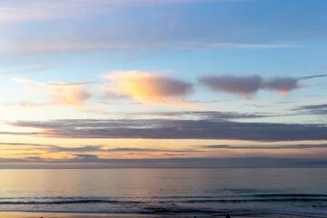 A view on the sky with the clouds during sunset