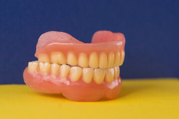 Close-up of dentures .Medical theme dental implants. Dental prosthetics. False jaw. Dental clinic. Selective focus